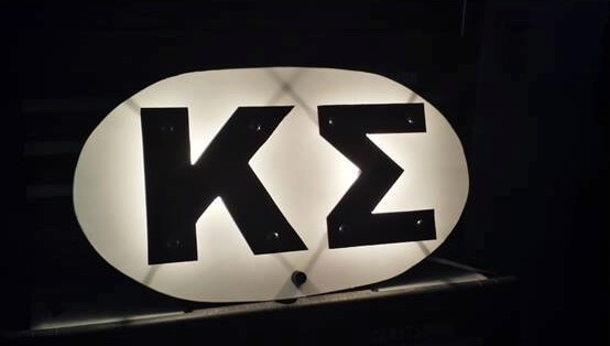 Omicron-Iota Initiate Fabricates Sheet Metal Sign